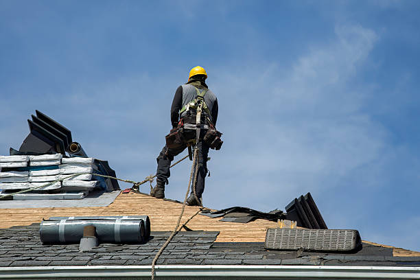 Professional Roof Replacement technician working in Northfield, VT
